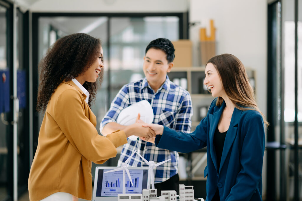 Three young people getting into sales