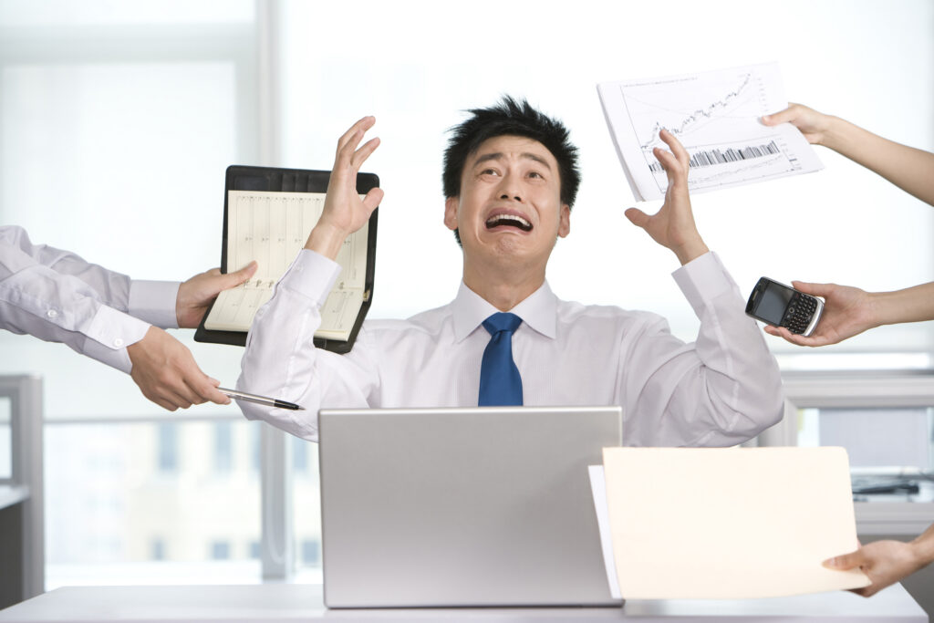 A customer acquisition strategist being overwhelmed with technology